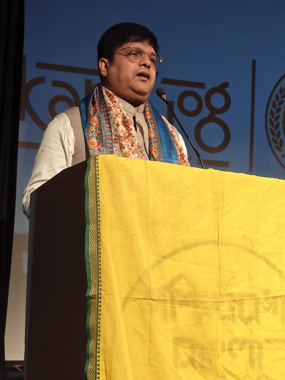 Shri Debashish Dhar at the lectern