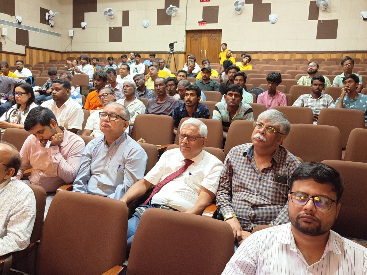 The front rows of the hall, listening